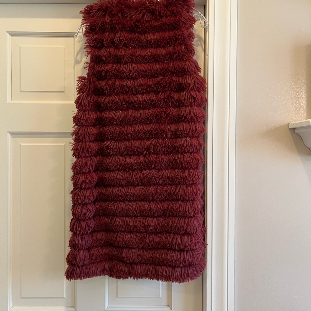 Red vest. Feathers? Fur? Not sure but really soft - Picture 2 of 3